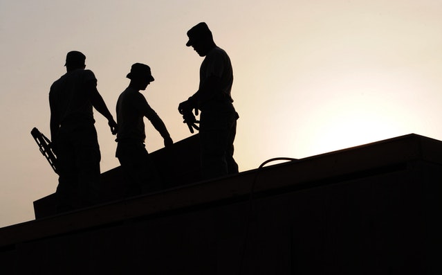 Workers at sunset